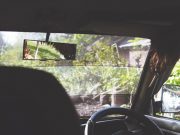 Rear view mirror dash cam – which is best? Car interior with rear view mirror on show for the rear view dashcam guide