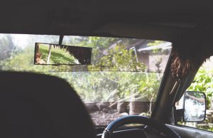 Rear view mirror dash cam – which is best? Car interior with rear view mirror on show for the rear view dashcam guide